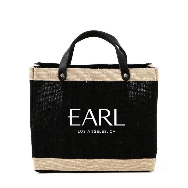 Black tote bag with 'EARL' branding on a white background