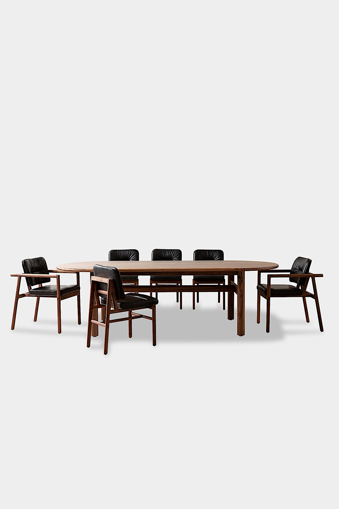 The PALANG Dining Table by Earl Home boasts a robust oval design in rich walnut, supported by four legs and a crossbeam. It comes on a plain white background and offers customizable lengths for perfect fitting in any space.