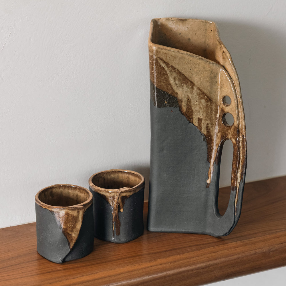 Square shaped pitcher in charcoal clay with a brown Carmel glaze on top. Hand sculpted from slab rolled clay in Los Angeles, california. Made in America 