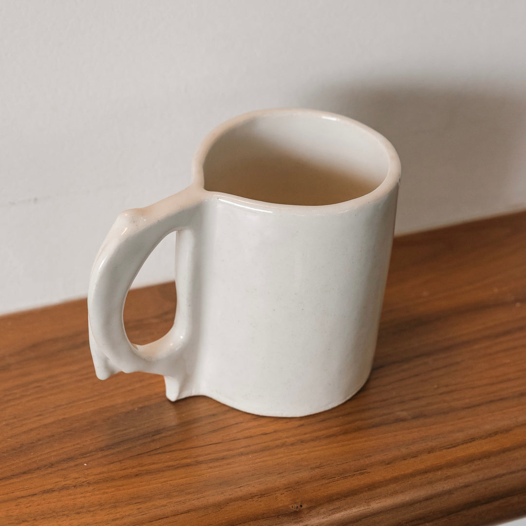 Hand sculpted Ceramic mug ivory gloss glaze. Slab rolled hand built in Los Angeles, California. Made in America.