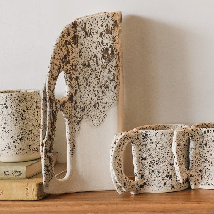 Square shaped pitcher in bmix ivory clay with a brown speckle glaze on top. Hand sculpted from slab rolled clay in Los Angeles, california. Made in America 