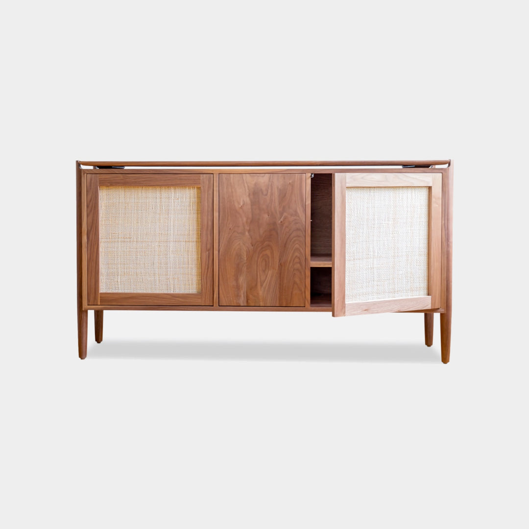 The KABOT Sideboard (Low) by Earl Home is a wooden mid-century modern dresser, featuring two woven panels and slender legs, exemplifying heritage quality design.