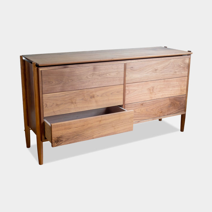 The KABOT Sideboard (Low) by Earl Home is a wooden mid-century modern dresser, featuring two woven panels and slender legs, exemplifying heritage quality design.