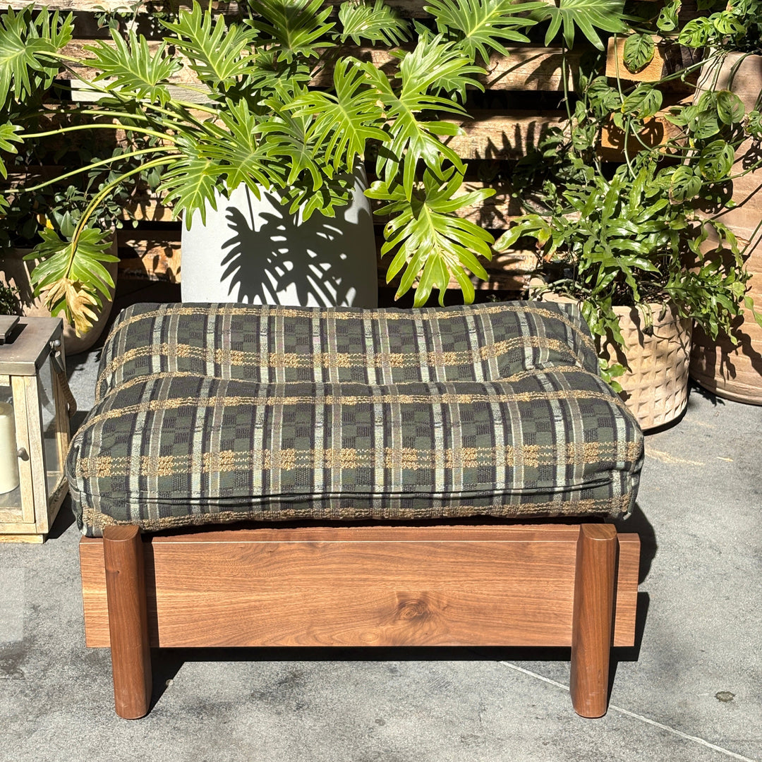 This EARL handmade dog bed has a solid wood base with a hidden drawer, and a custom detachable cushion upholstered in Sunbrella Blend Sand. We offer various fabrics and customers own fabric is encouraged as well. The base can be made in walnut, white oak, or ebonized oak and custom sizing is also available.